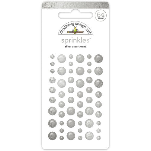 54 self-adhesive enamel dots in small, medium, and large sizes. All silver. From Doodlebug Design.