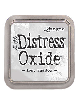 LOST SHADOW Distress Oxide Ink Pad, Ranger - Gray distress oxide ink is a blend of dye and pigment ink for paper projects. The water-reactive ink marbles when misted with water for a distressed ink look.