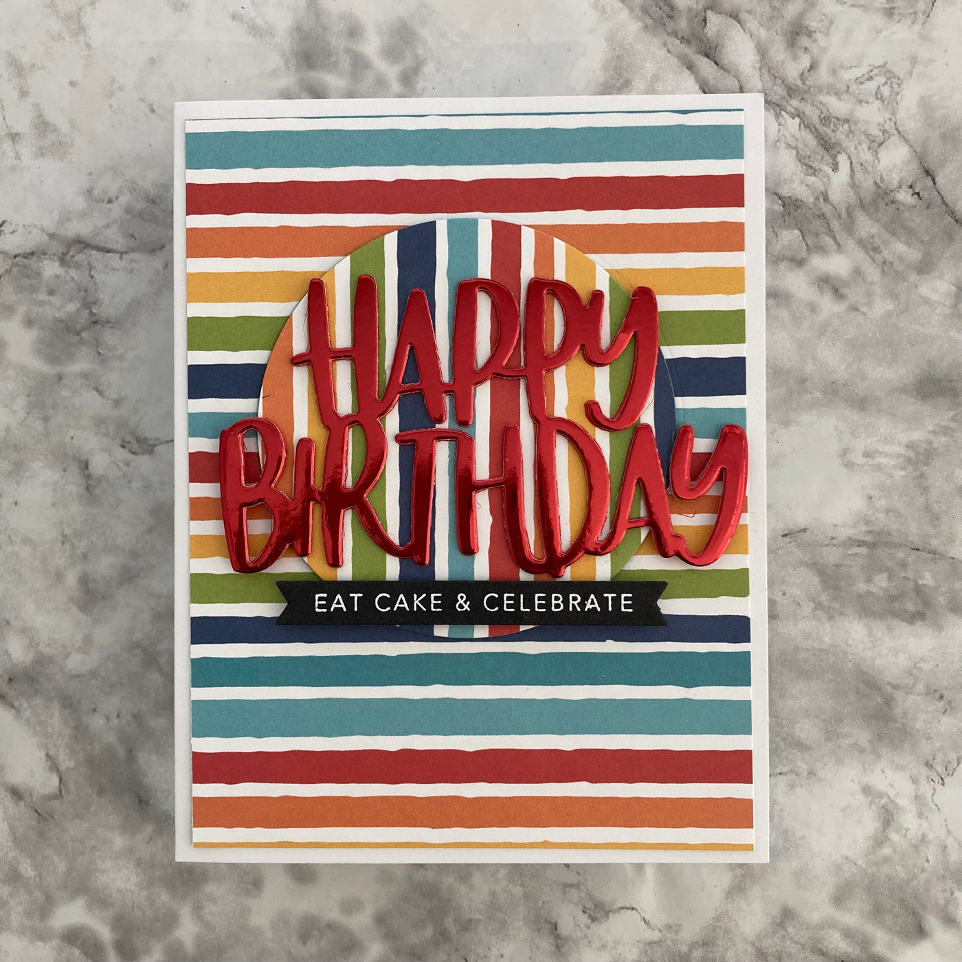 handmade birthday card featuring striped pattern paper and bright red foil paper